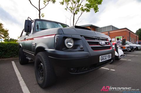1989 Ford Bronco - This 1989 Ford Bronco is parked in a lot with other vehicles visible in the background.