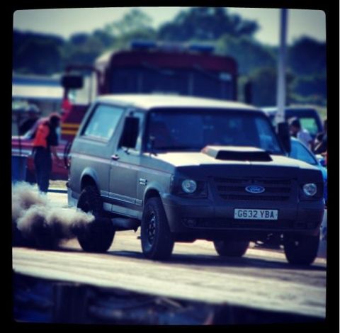 1989 Ford Bronco - This Ford Bronco is seen on a track, producing a large cloud of exhaust smoke.