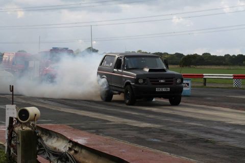 1989 Ford Bronco - This 1989 Ford Bronco is performing a burnout on a drag strip.