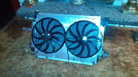 1967 Ford F-250 - A radiator assembly with dual electric fans is shown, likely a replacement part.