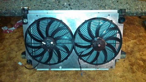 1967 Ford F-250 - A radiator assembly two large electric cooling fans is shown.