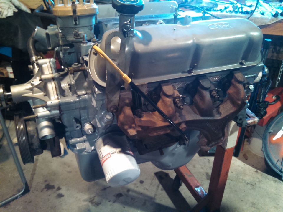 Ford V8 engine with oil filter and distributor, mounted on an engine stand