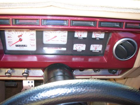 1985 Ford Bronco - Interior view of a vehicle's dashboard, showing various gauges and an air vent.