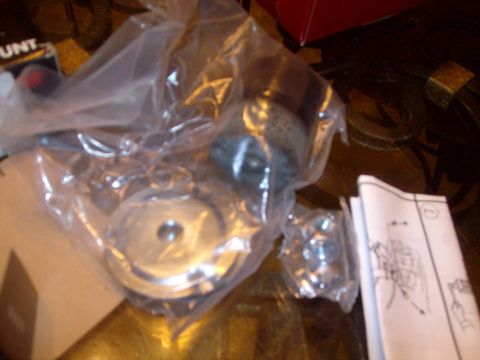 2004 Ford Crown Victoria - Unidentified suspension components and their instructions are laid out on a table.