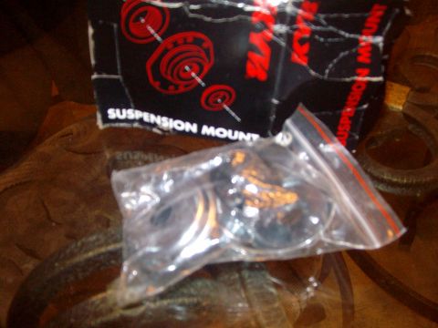 2004 Ford Crown Victoria - A box and a plastic bag containing suspension mount parts are shown. The box has red circular graphics and text.