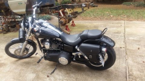 2014 Harley-Davidson FXDWGI Wide Glide - Side view of a black 2014 Harley-Davidson FXDWGI Wide Glide motorcycle.