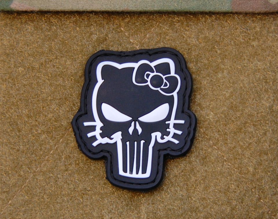 Black and white Hello Kitty skull patch on tan fabric