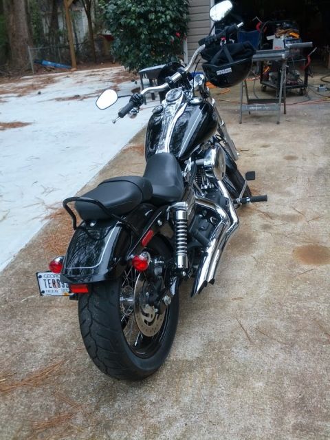 2014 Harley-Davidson FXDWGI Wide Glide - A black Harley-Davidson motorcycle is parked outdoors. The license plate is visible.