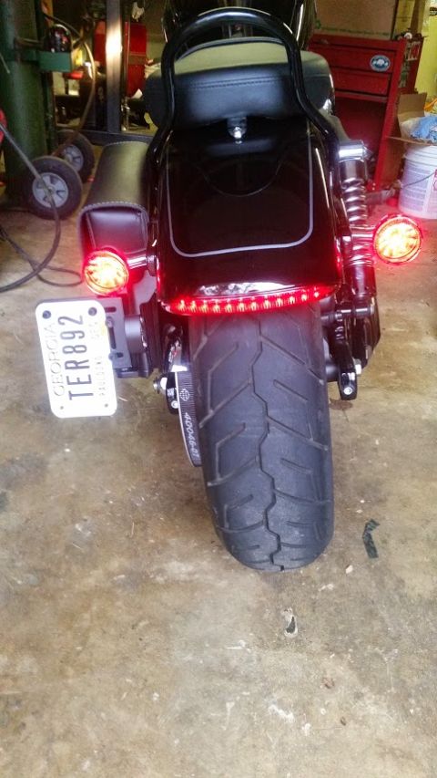 2014 Harley-Davidson FXDWGI Wide Glide - Rear view of a black motorcycle with a license plate and LED taillight strip.