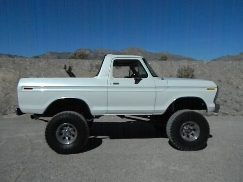1979 Ford Bronco - This lifted 1979 Ford Bronco is shown in a side profile against a desert landscape.
