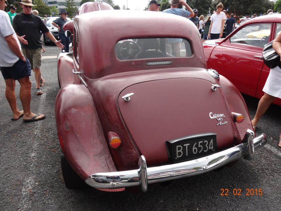 Maroon coupe rear view with chrome bumper and license plate BT 6534