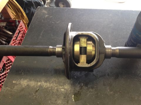 1987 Suzuki Samurai - A differential assembly, likely from a vehicle's drivetrain, is shown on a workbench.