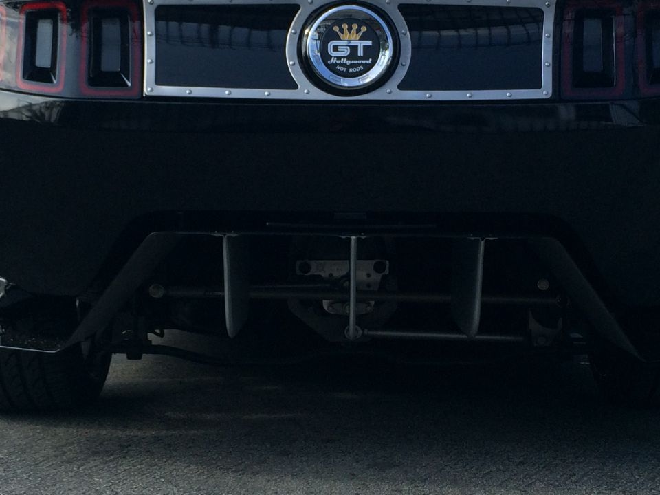 Rear view of a black car with a GT badge that says 'Hollywood Hot Rods'