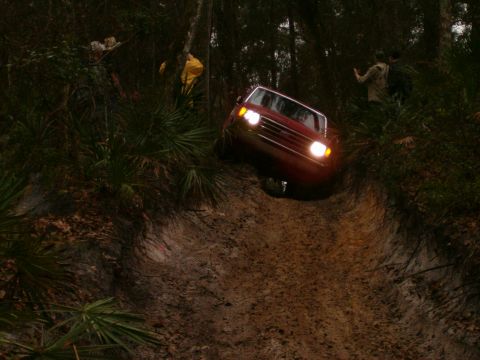 1991 Ford Bronco - This 1991 Ford Bronco navigates a challenging muddy off-road path.