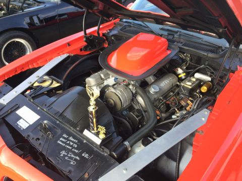 1968 Ford Mustang - A trophy sits in the engine bay of a car, with handwritten text on the fender.
