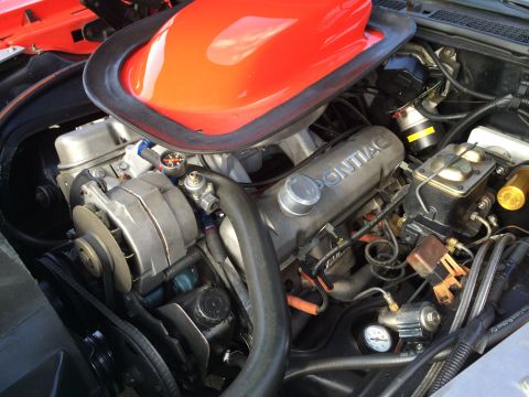 1968 Ford Mustang - Close-up of an engine bay, showing the intake scoop and valve covers.