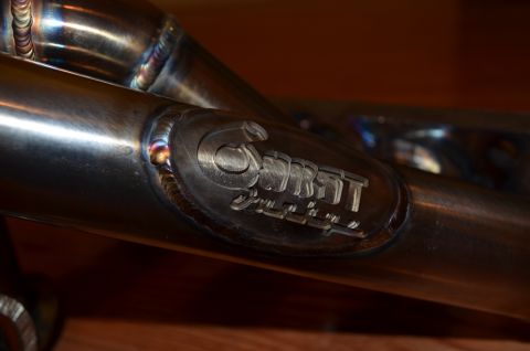 2007 Mazda 6 - Close-up of a polished exhaust manifold a stamped Garrett logo.