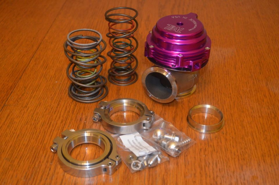 Purple blow-off valve with assorted springs, clamps, and hardware
