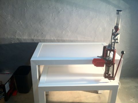1992 Ford Mustang - A reloading press is set up on a table, ready for use.
