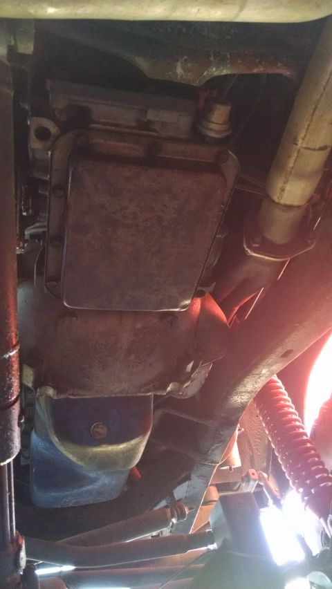 1985 Jeep CJ7 - Underside view of a vehicle's mechanical components, including the transmission and exhaust system.