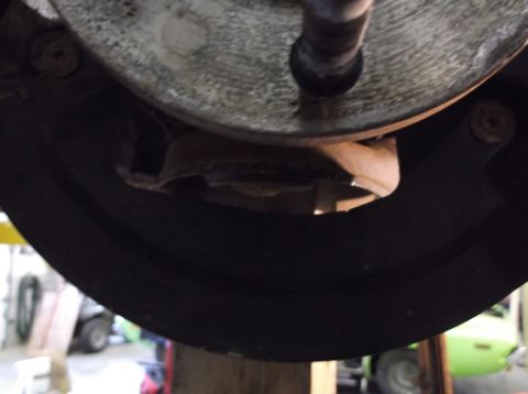 1999 Mercury Grand Marquis - Underside view of a vehicle's brake drum assembly, showing the brake shoes and drum.
