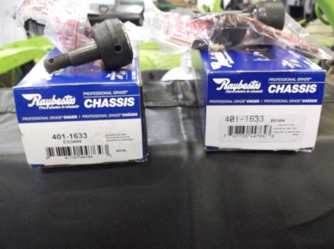 1999 Mercury Grand Marquis - Two boxes of Raybestos chassis ball joints, part number 401-1633, are displayed on a dark surface.