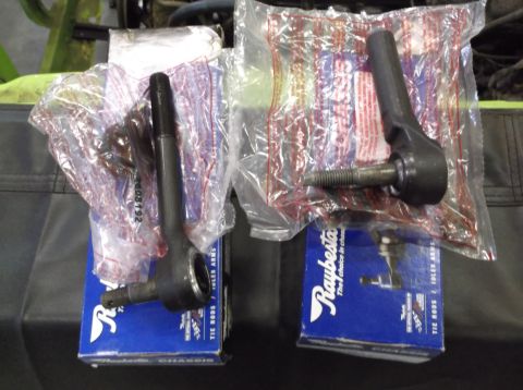 1999 Mercury Grand Marquis - Two new Raybestos inner tie rod ends in plastic bags resting on their blue product boxes.