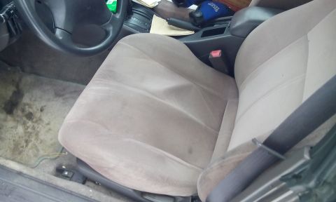 1996 Subaru Legacy - Interior view of a car, focusing on the passenger seat and center console area.