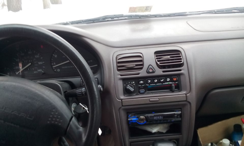 1996 Subaru Legacy interior dashboard with aftermarket stereo