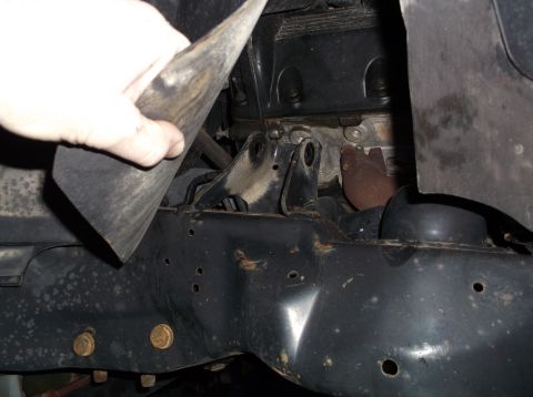 1999 Mercury Grand Marquis - Underside view of engine and frame components, possibly during a repair or inspection.