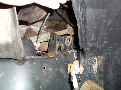1999 Mercury Grand Marquis - Undercarriage view showing suspension components and wiring, with visible rust and wear.