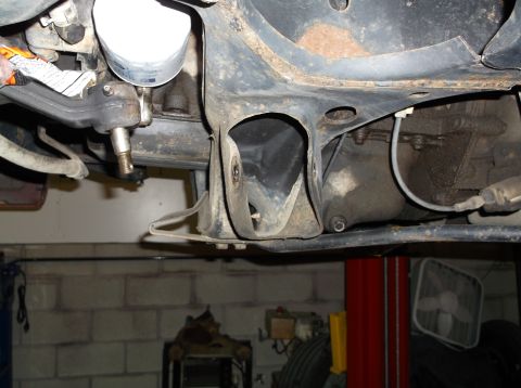 1999 Mercury Grand Marquis - Undercarriage view of a vehicle, showing suspension and engine parts.