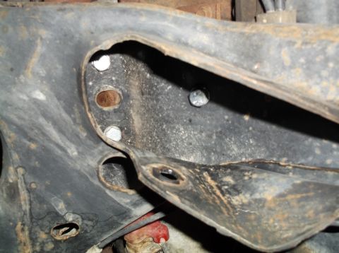 1999 Mercury Grand Marquis - This image shows a close-up view of a vehicle's undercarriage, focusing on the frame and suspension components.