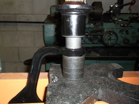 1999 Mercury Grand Marquis - Pressing a suspension bushing into place using a C-clamp and socket set.