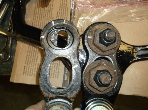 1999 Mercury Grand Marquis - Comparison of a new and a worn automotive suspension part, showing rust and wear.