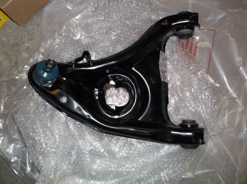 1999 Mercury Grand Marquis - New control arm and ball joint assembly, likely for a front end rebuild.