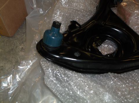 1999 Mercury Grand Marquis - New suspension control arm and ball joint, packaged for shipping.