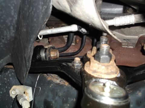 1999 Mercury Grand Marquis - Vehicle suspension components, including a ball joint and linkage, are visible in this close-up shot.