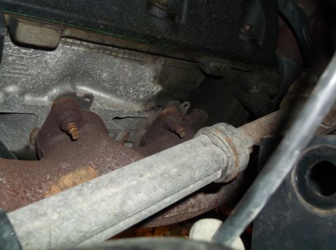 1999 Mercury Grand Marquis - Exhaust manifold and pipe detail, showing rust and wear.
