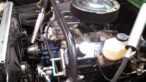 1967 Ford F-250 - The engine bay shows a Ford 302 V8 engine with aftermarket air intake and chrome valve covers.