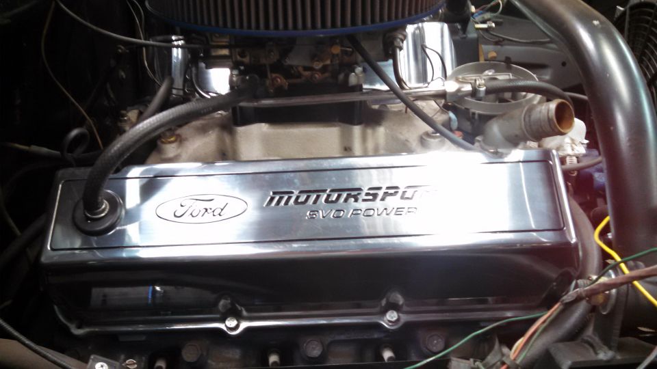 Chrome Ford Motorsport EVO Power valve covers on a V8 engine, close-up view