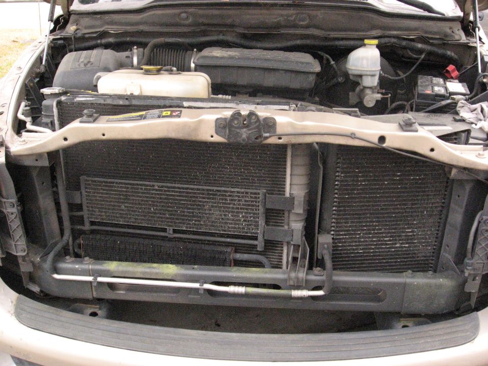 This is the first time I've ever seen a setup like this. Instead of the A/C condensor being in front of the radiator they are side by side and sit crooked to fit.