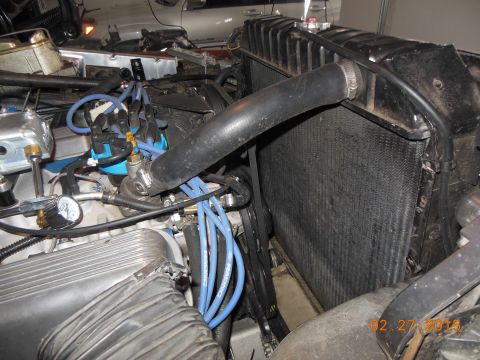 1979 Ford F-150 - Close-up view of an engine bay, showing the radiator, distributor, and associated wiring.