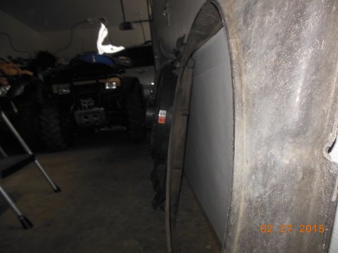 1979 Ford F-150 - Interior view of a vehicle's wheel well, with another vehicle in the background.