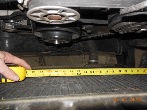 1979 Ford F-150 - Measuring radiator width in the engine bay of a vehicle.