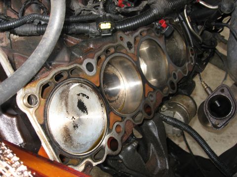 1994 Ford Bronco - Driver side head removed, one valve has hit the piston but aside from an indentation the piston and bore appear unharmed.