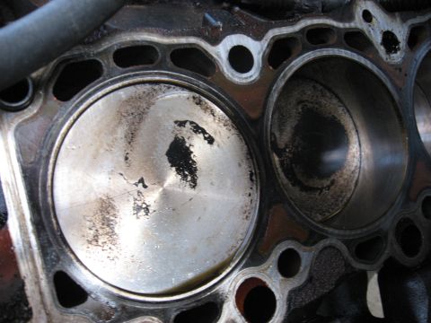1994 Ford Bronco - Engine block with pistons and cylinder bores, showing signs of wear and carbon deposits.