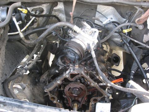 1994 Ford Bronco - The engine's timing components are visible in this close-up view of the engine bay.