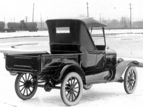 1909 Ford Model T - This Ford Model T pickup truck features a wooden bed and spoked wheels, seen here in a winter setting.