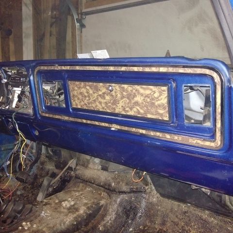 1978 Ford Bronco - Interior view of a 1978 Ford Bronco dashboard, showing the center console and surrounding components.